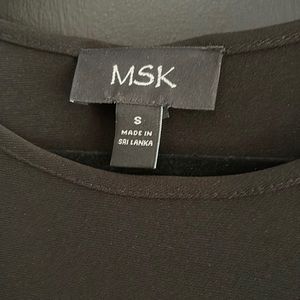 Black dress. Right above knee, I’m 5.6 for reference.